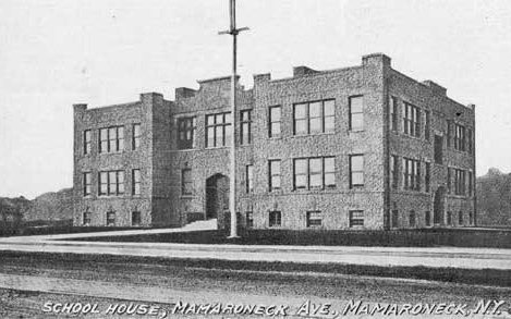 Postcard of the original two-story Mamaroneck Avenue schoolhouse beside an empty dirt road.